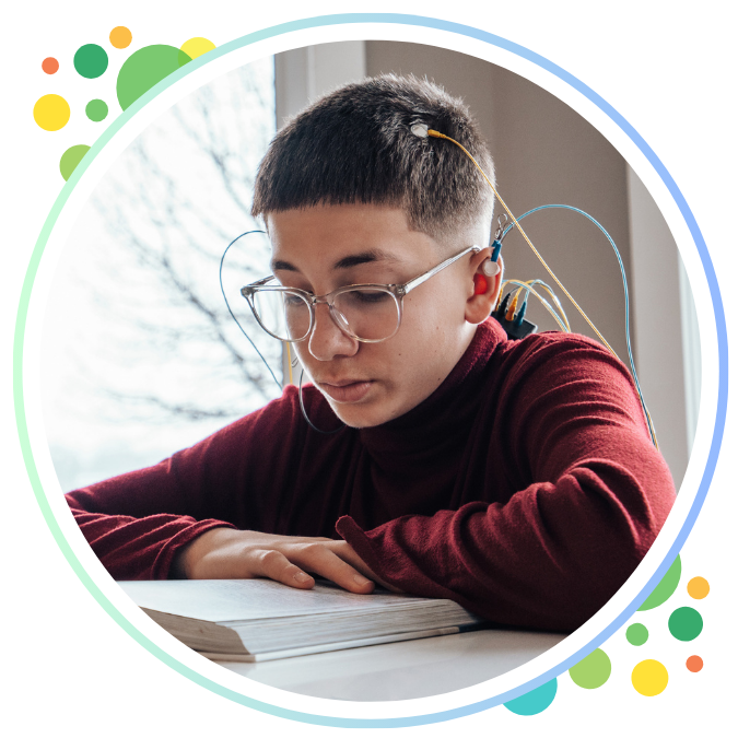 holistichealthybrain-boy-studying-while-doing-home-neurofeedback holistichealthybrain-boy-studying-while-doing-home-neurofeedback